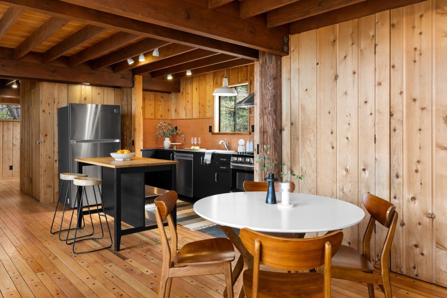 73 Mt Devon Road Carmel Highlands, CA 93923 - Photo 18 of 88 a kitchen with a table and chairs in it