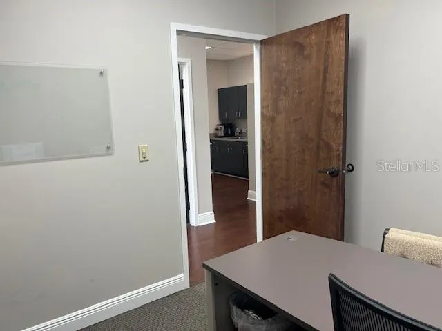 a view of a hallway and dining room