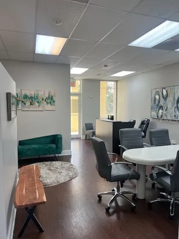 a living room with furniture rug and window