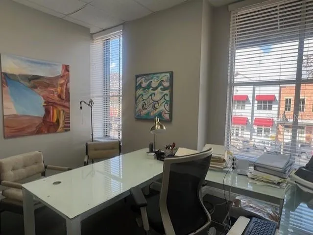 a view of a dining room with furniture and window