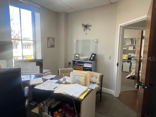 a view of a dining room with furniture window and outside view