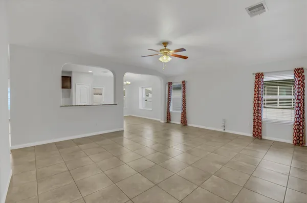 a view of a ceiling fan with a carpet