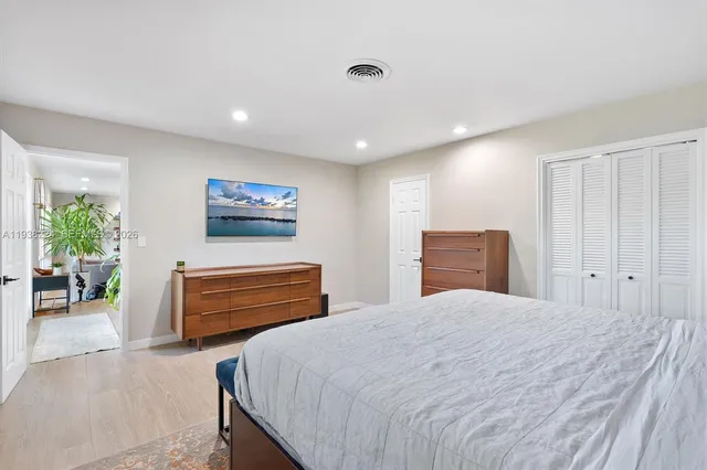 a view of a swimming pool and a patio