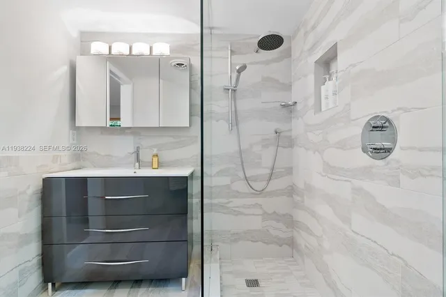 a view of a living room and kitchen