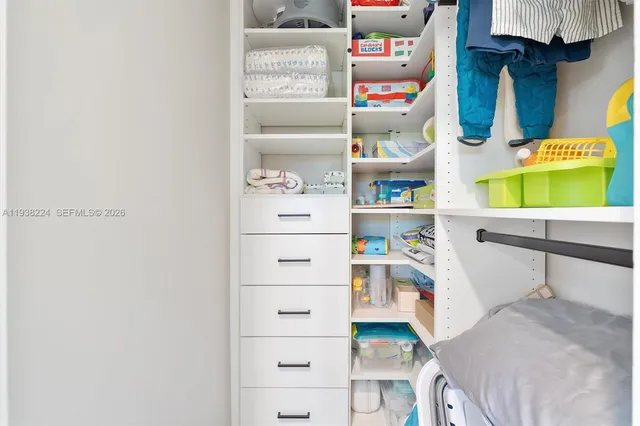 a kitchen with cabinets appliances and a sink