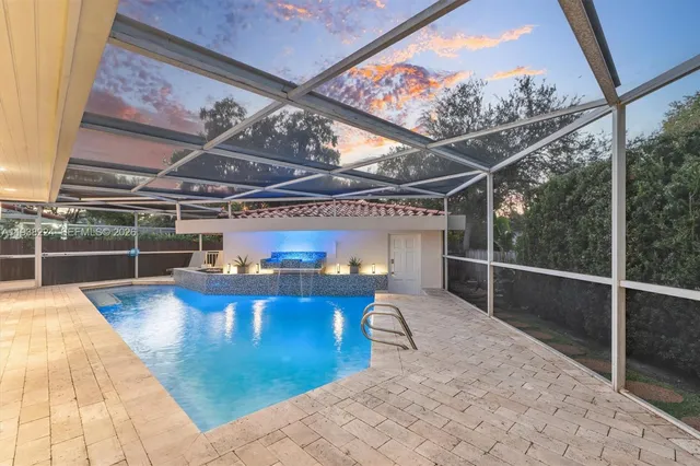 a view of a kitchen with a sink and breakfast area