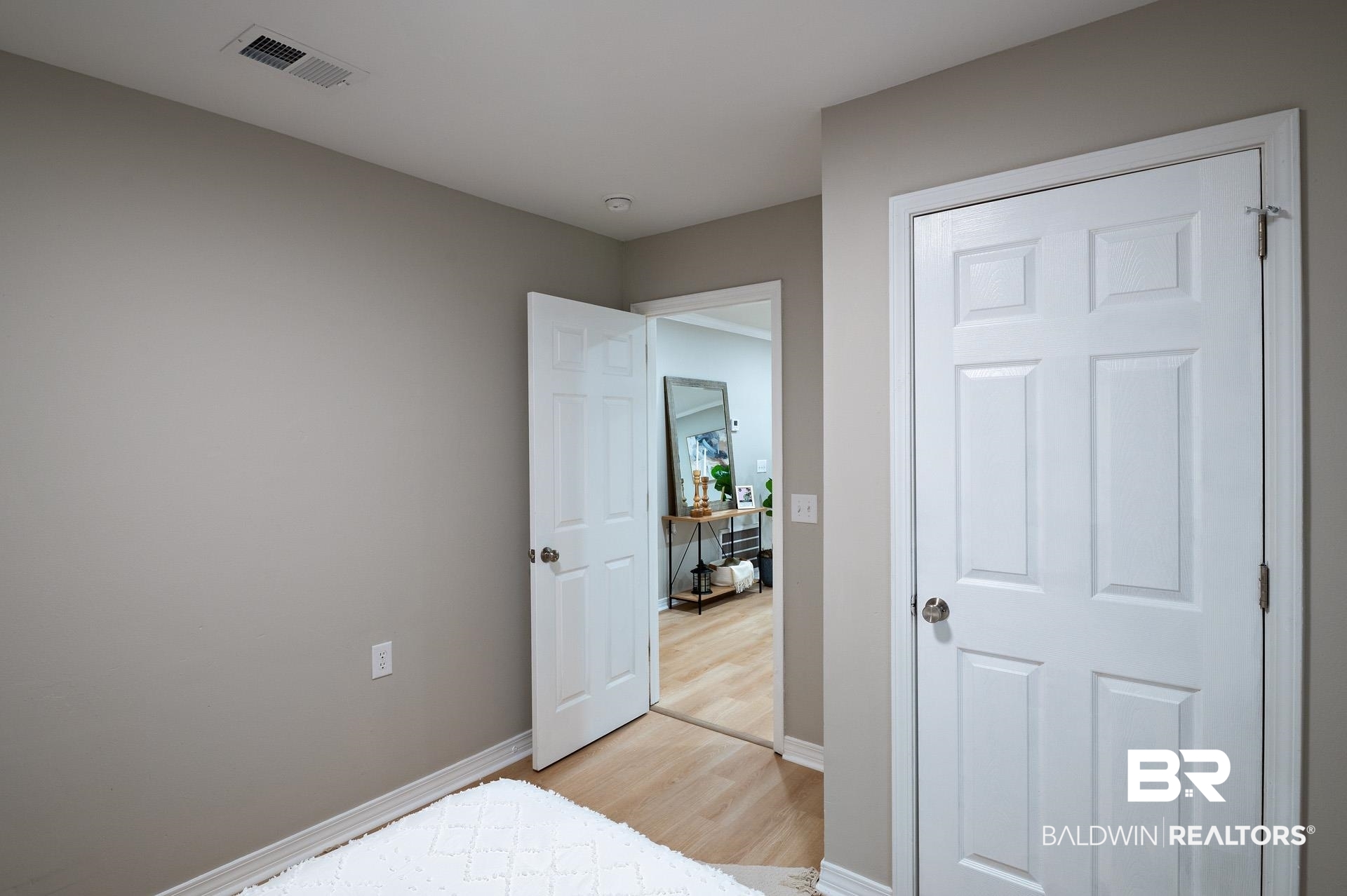 13474 Rooster Lane Foley, AL 36535 - Photo 25 of 39 Bedroom featuring light wood-style floors, baseboards, and visible vents