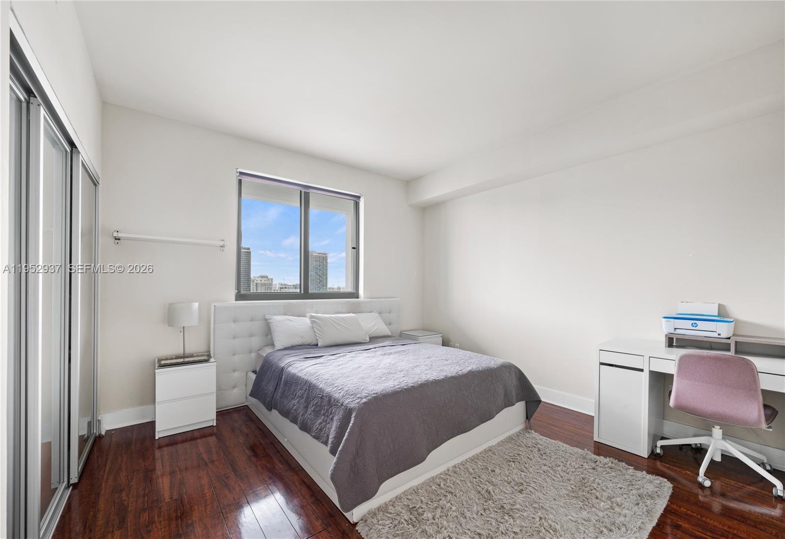 601 Northeast 36th Street, Unit 1704 Miami, FL 33137 - Photo 14 of 19 a bedroom with a bed and chair