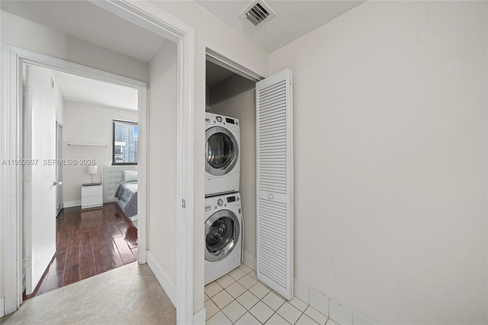 601 Northeast 36th Street, Unit 1704 Miami, FL 33137 - Photo 17 of 19 a view of a kitchen with washer and dryer