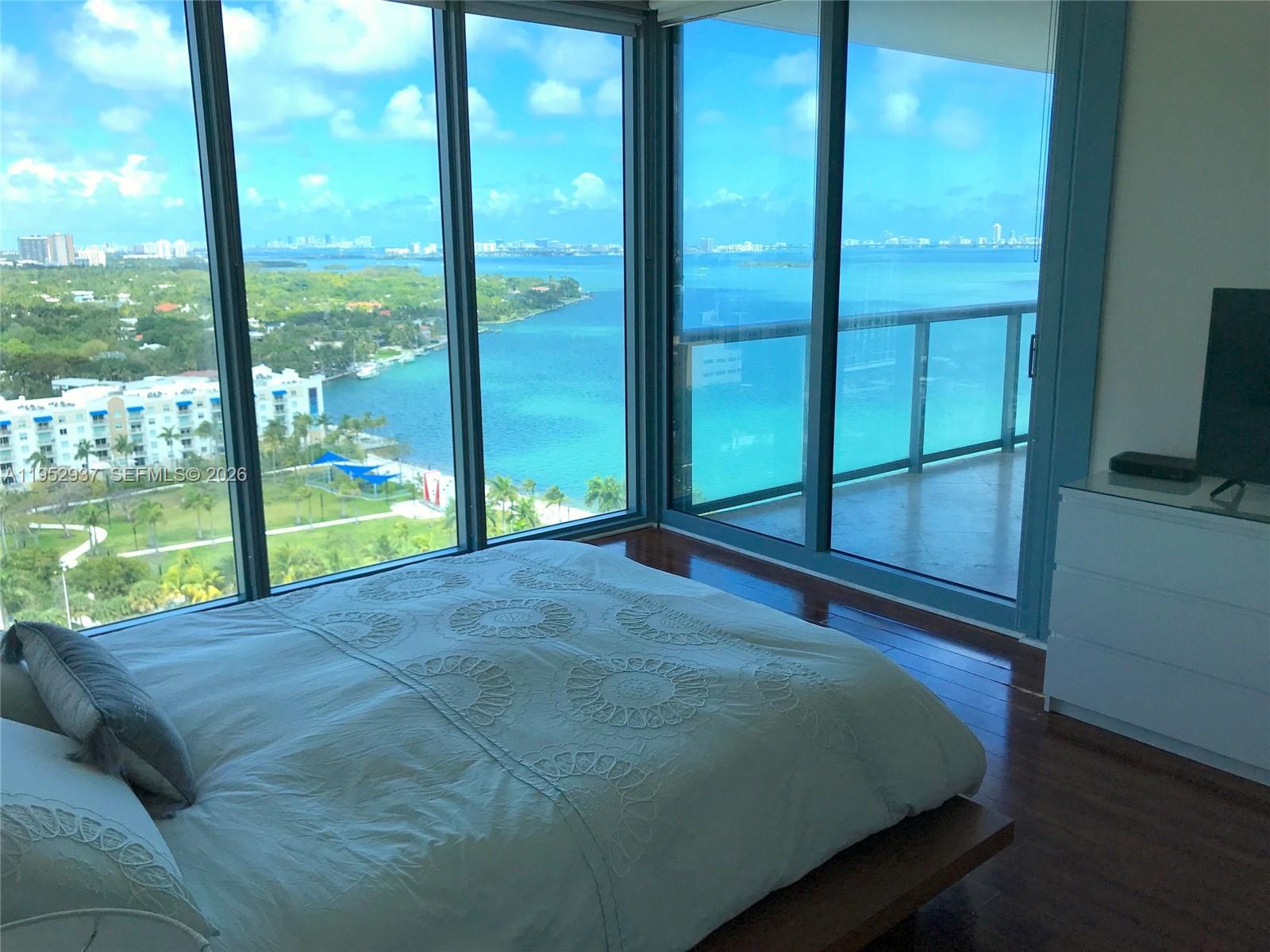 601 Northeast 36th Street, Unit 1704 Miami, FL 33137 - Photo 10 of 18 a bed sitting in a bedroom next to a window