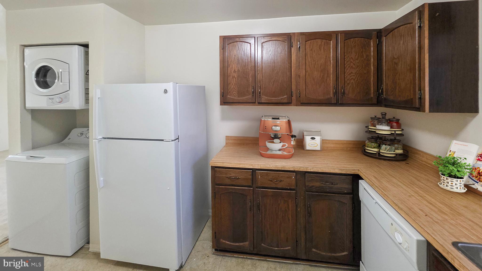 3928 Rolling Rd., Unit C10 Pikesville, MD 21208 - Photo 6 of 26 a kitchen with a refrigerator and cabinets