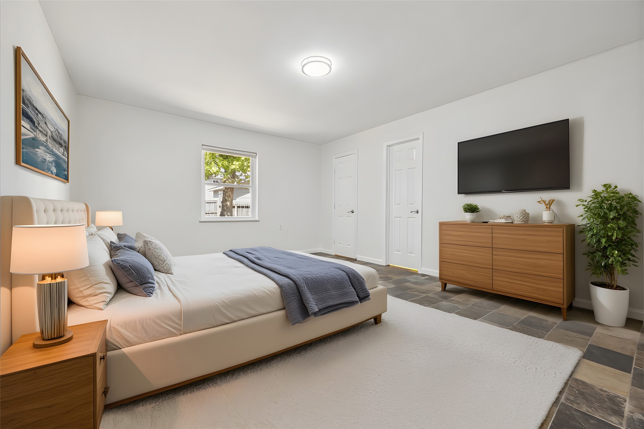 9014 Dunlap Street Houston, TX 77074 - Photo 15 of 23 The primary suite includes a private ensuite bath, a spacious walk-in closet, and a large window with views of the backyard. Freshly painted, the room feels bright and inviting.