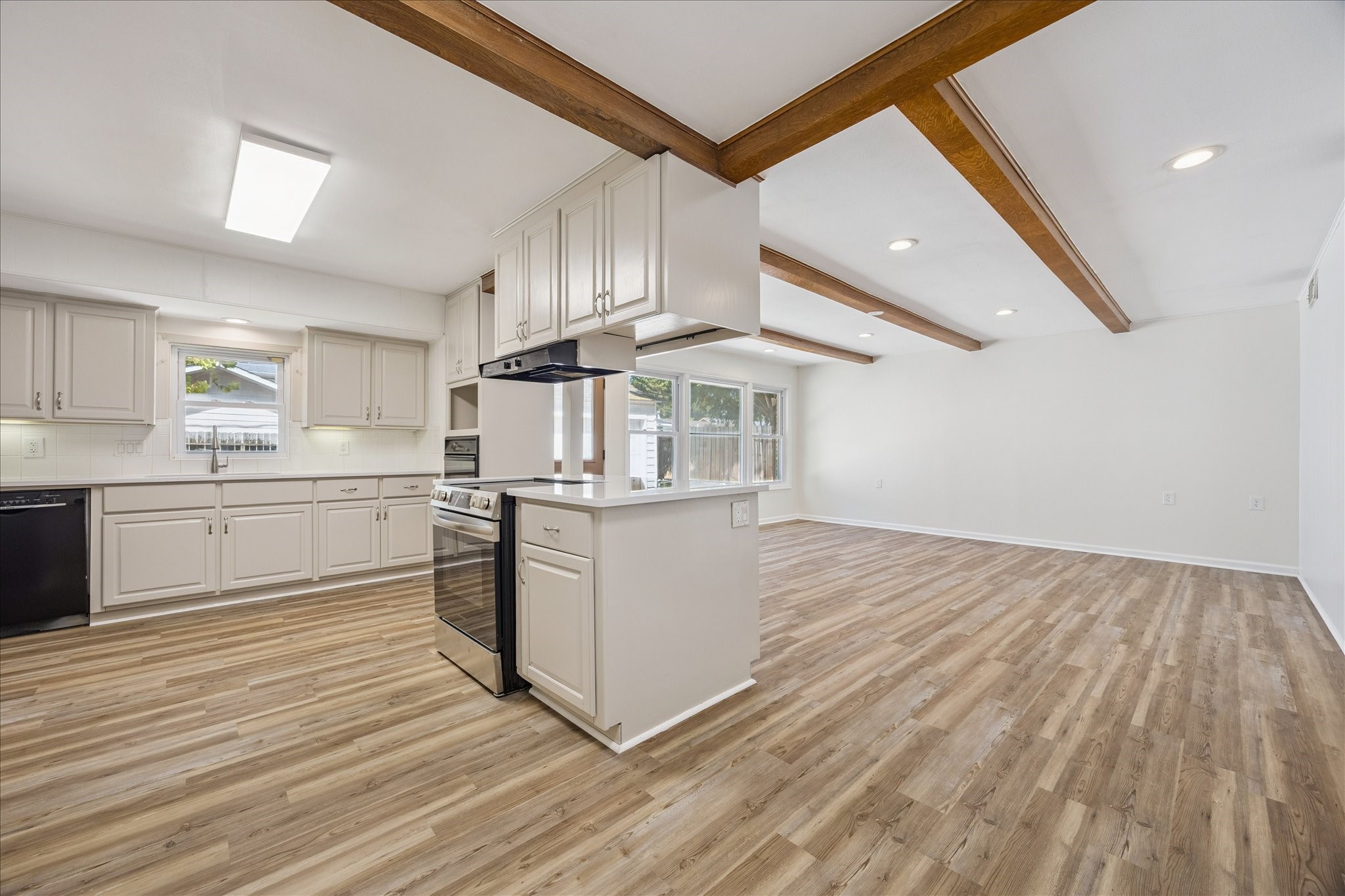 9014 Dunlap Street Houston, TX 77074 - Photo 3 of 23 Another view of the kitchen and family room showcasing the open, spacious layout.