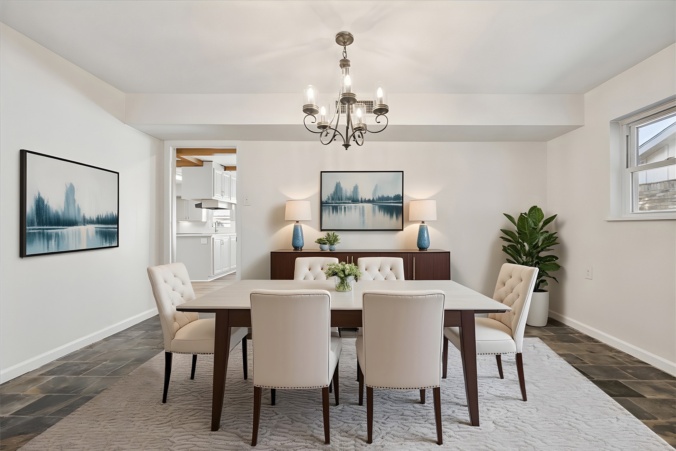 9014 Dunlap Street Houston, TX 77074 - Photo 10 of 23 The dining room is ideally positioned just off the kitchen and family room, featuring a statement chandelier and a window that fills the space with natural light. The room also flows seamlessly into the home office or formal living area, creating an open and versatile layout. *Virtually staged.*