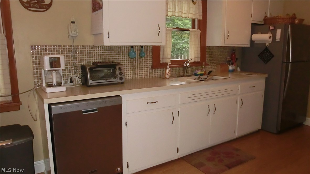 1303 Haverston Road Lyndhurst, OH 44124 - Photo 5 of 34 NewerDishwasher, frig,and stove stay.