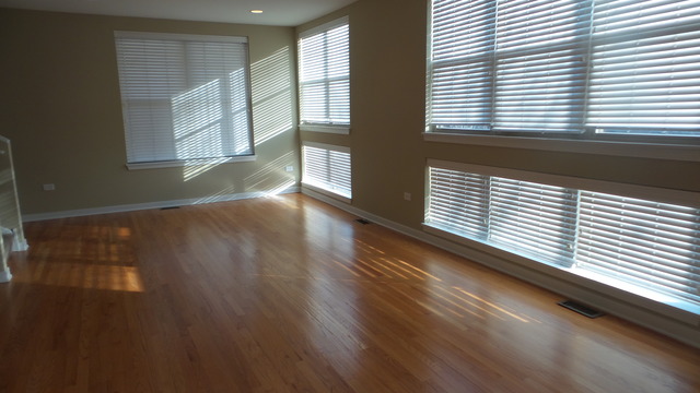 1244 West Monroe Street, Unit 1 Chicago, IL 60607 - Photo 20 of 25 a view of a room with wooden floor and a window