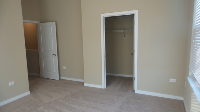 1244 West Monroe Street, Unit 1 Chicago, IL 60607 - Photo 21 of 25 an empty room that has a grey walls