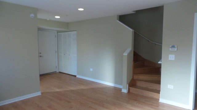 1244 West Monroe Street, Unit 1 Chicago, IL 60607 - Photo 5 of 25 a view of an empty room with wooden floor