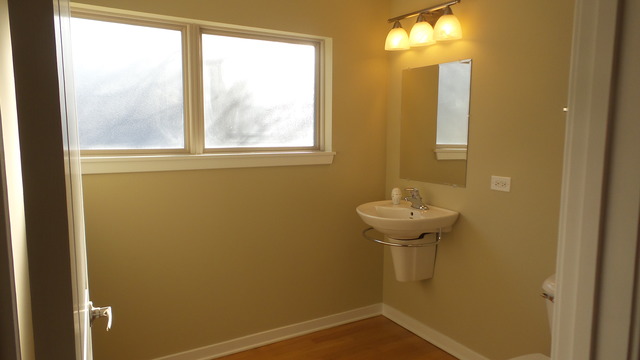 1244 West Monroe Street, Unit 1 Chicago, IL 60607 - Photo 9 of 25 a bathroom with a sink and a toilet