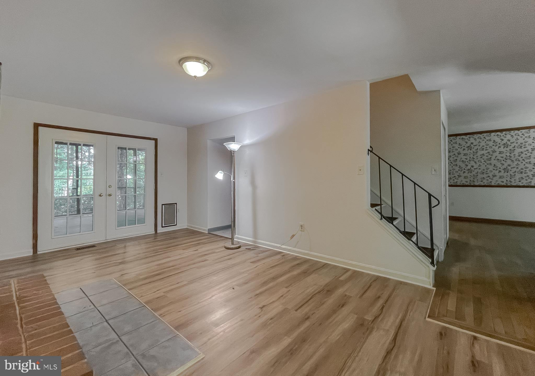 960 Bowie Shop Road Huntingtown, MD 20639 - Photo 22 of 69 a view of an empty room with wooden floor and a window