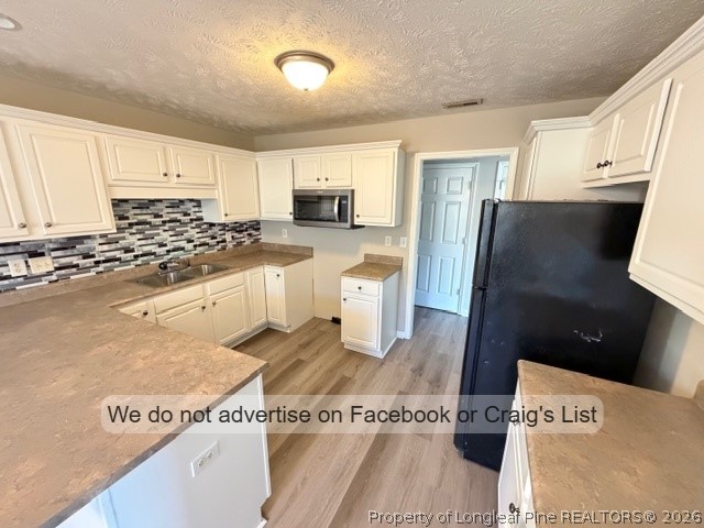 132 Congaree Drive Raeford, NC 28376 - Photo 4 of 13 a view of a kitchen with stainless steel appliances granite countertop a refrigerator and a stove top oven