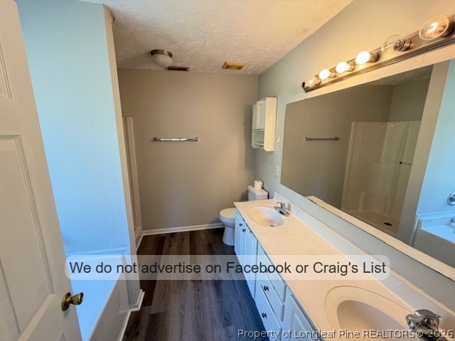 132 Congaree Drive Raeford, NC 28376 - Photo 7 of 13 a bathroom with a tub a sink and wooden floor