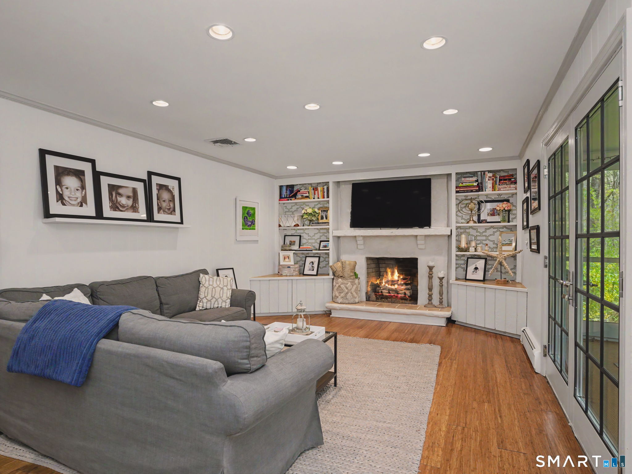 45 Wendover Road Trumbull, CT 06611 - Photo 18 of 33 Large Familyroom with gas fireplace and built-ins and French doors.