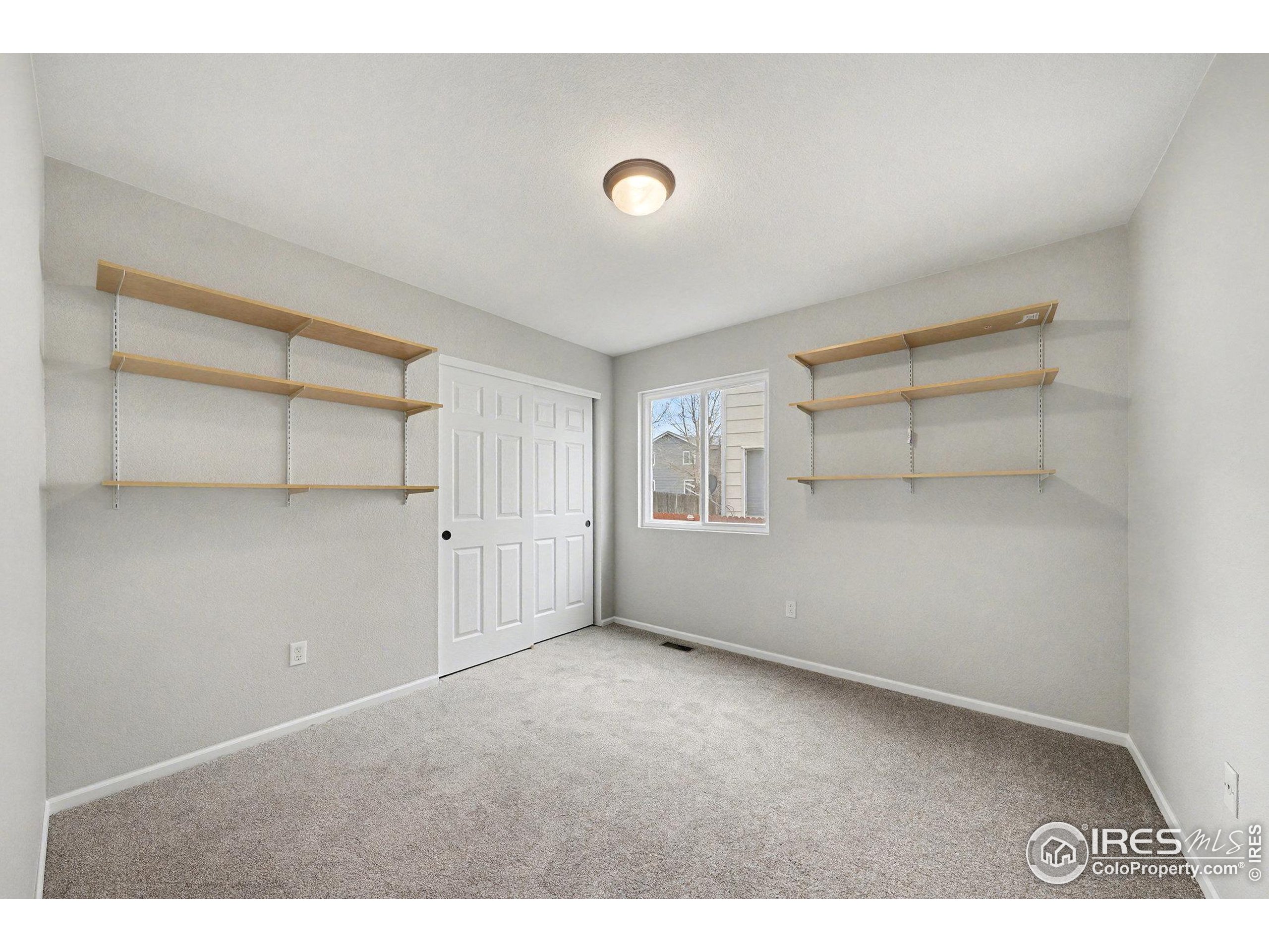5740 High Street Frederick, CO 80504 - Photo 11 of 34 a view of an empty room with a window