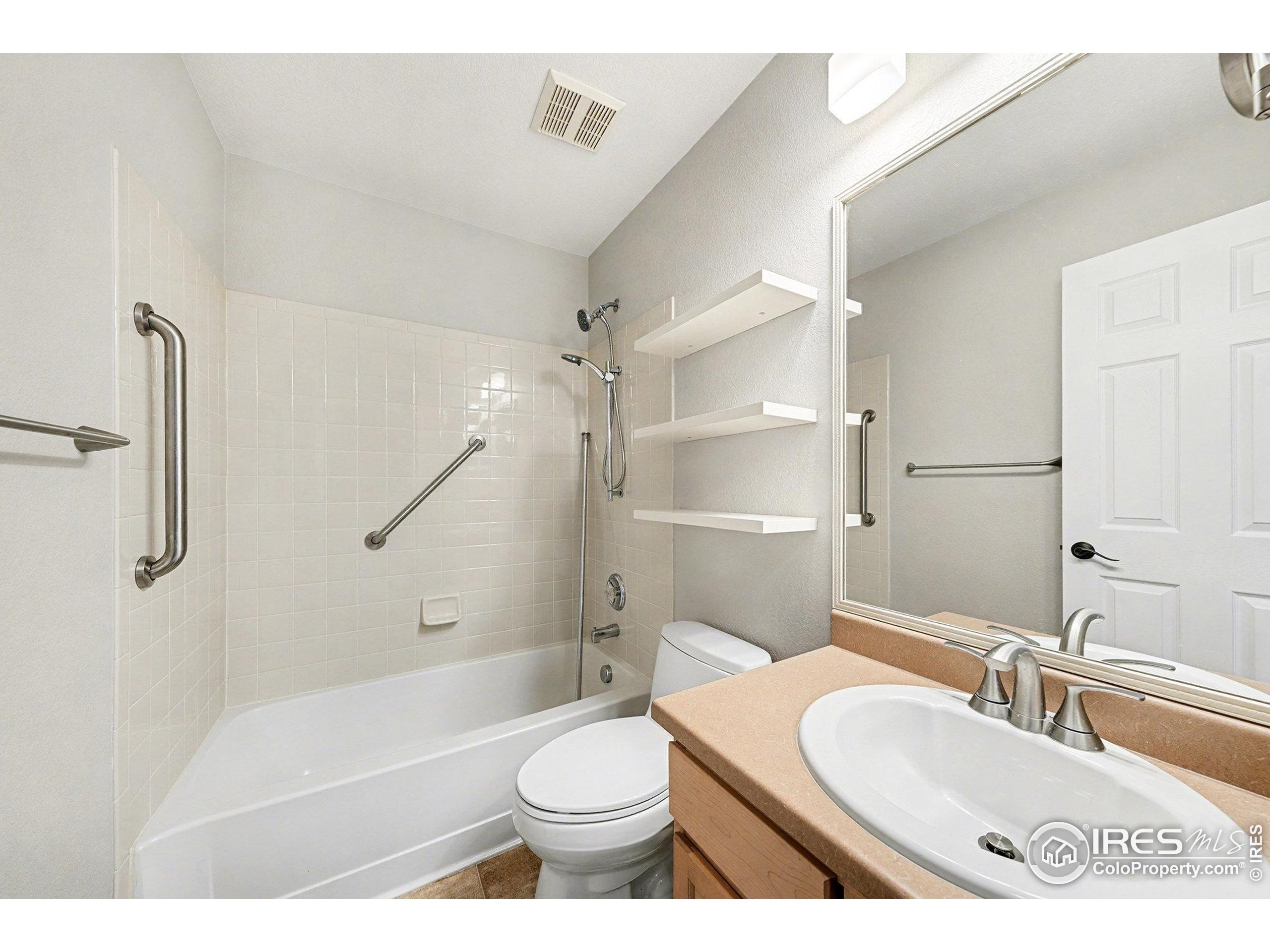 5740 High Street Frederick, CO 80504 - Photo 13 of 34 a bathroom with a sink toilet and shower