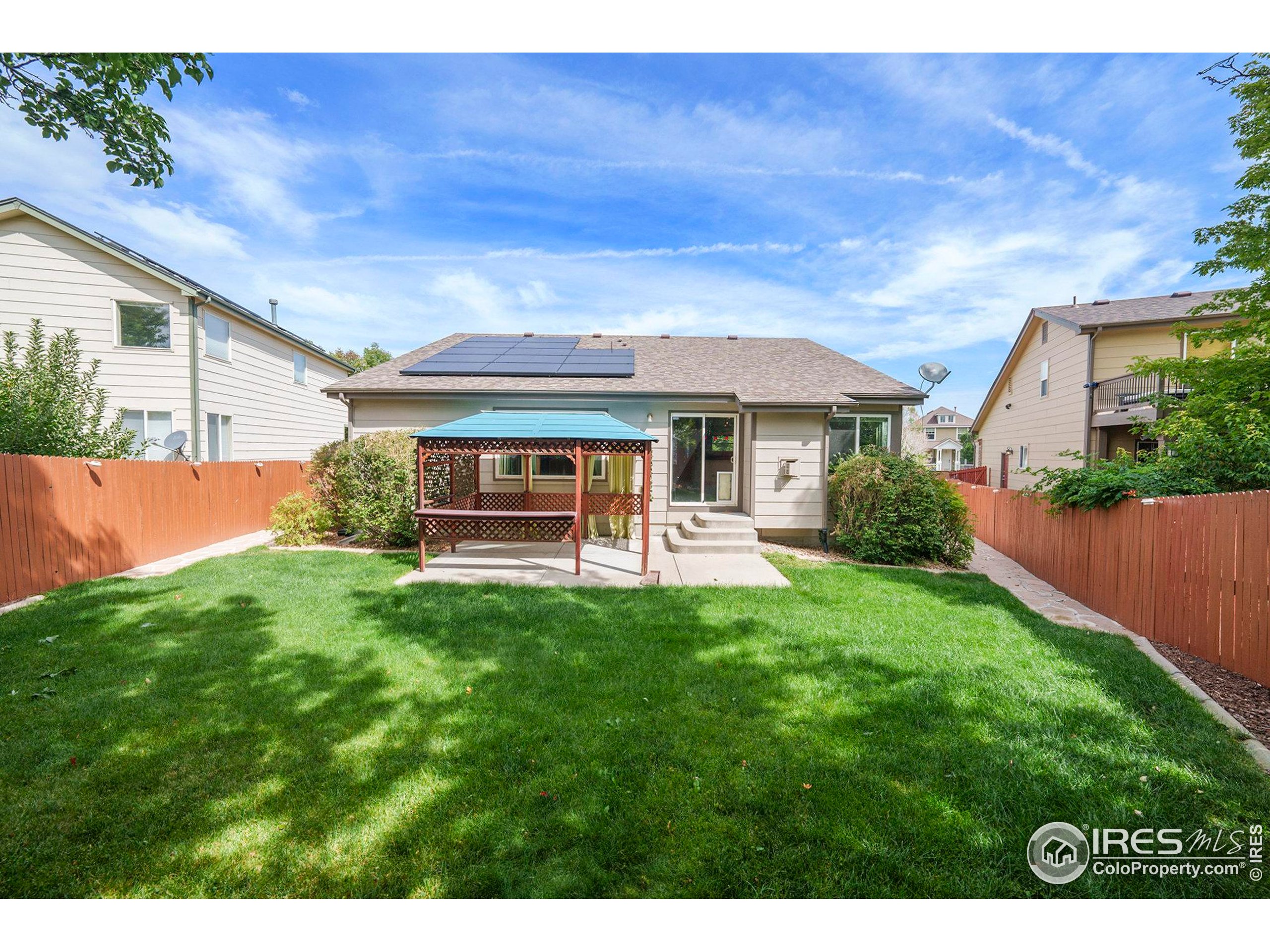 5740 High Street Frederick, CO 80504 - Photo 25 of 34 a front view of a house with a yard