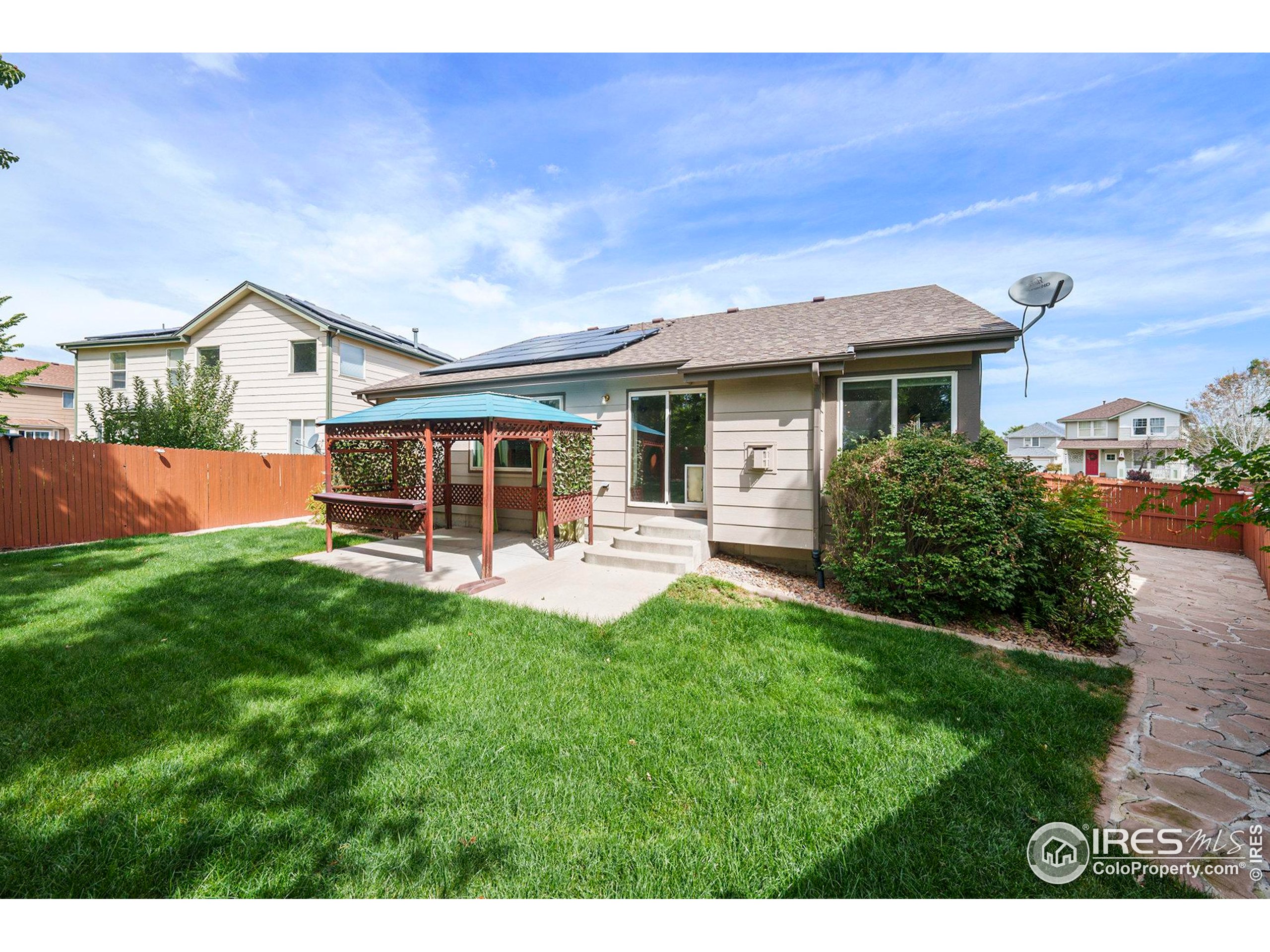 5740 High Street Frederick, CO 80504 - Photo 26 of 34 a front view of a house with yard patio and green space