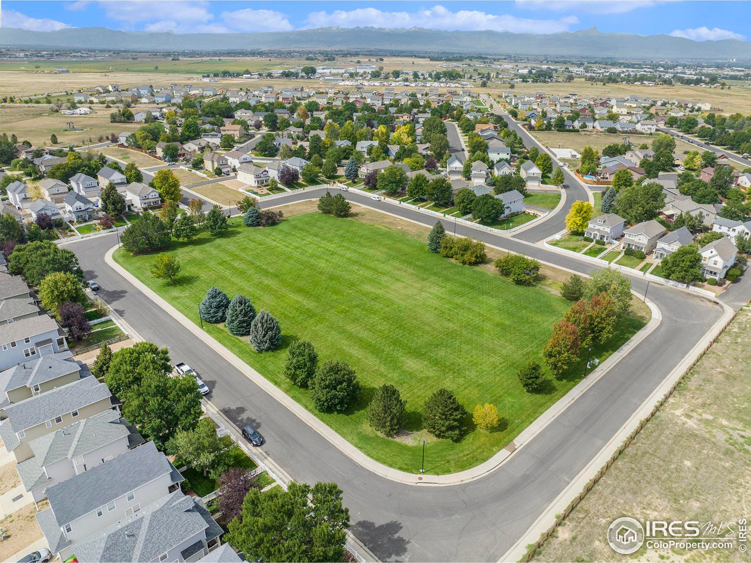 5740 High Street Frederick, CO 80504 - Photo 31 of 34 an aerial view of residential houses with outdoor space and trees