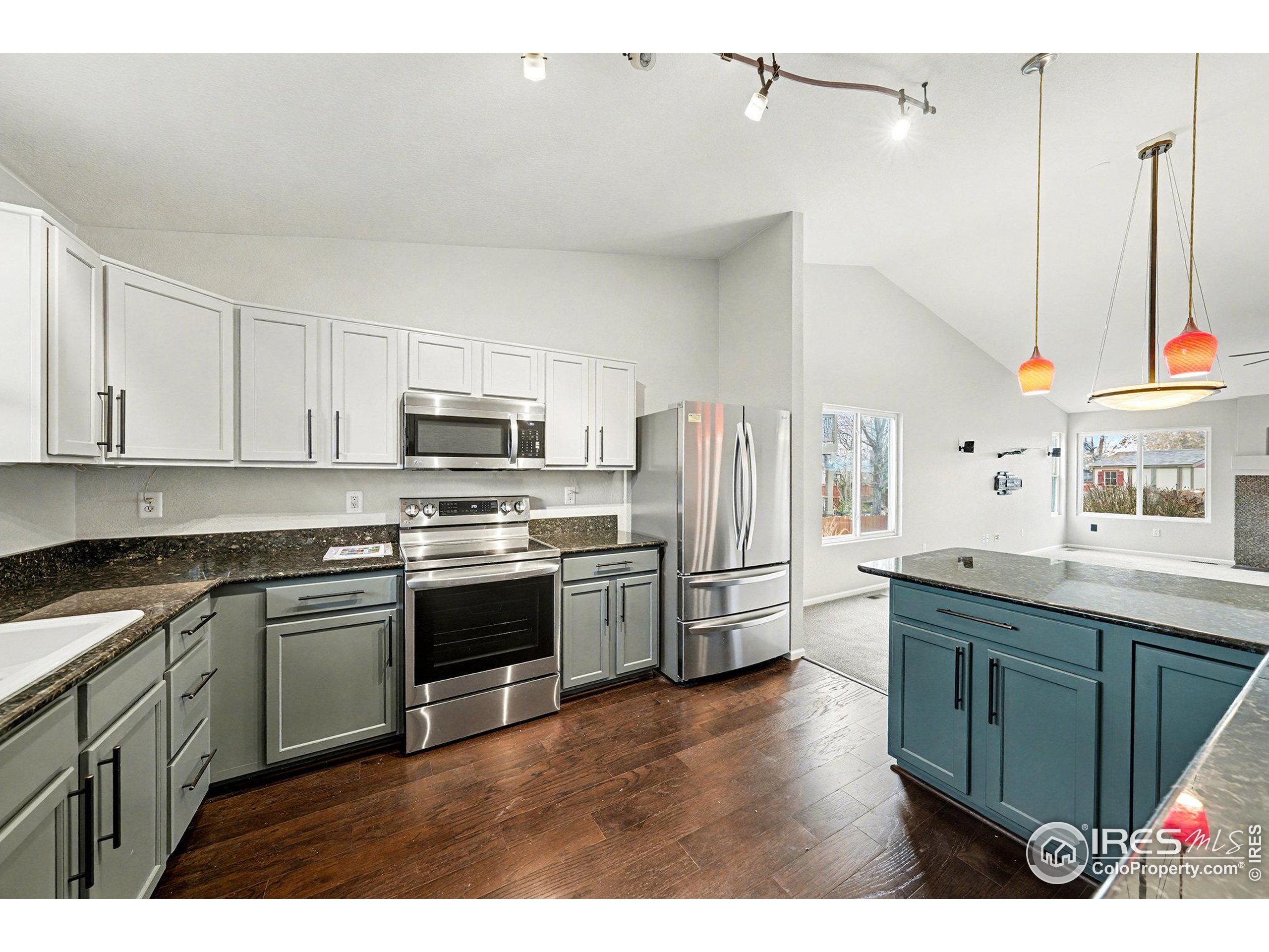 5740 High Street Frederick, CO 80504 - Photo 5 of 34 a kitchen with stainless steel appliances granite countertop a stove a sink and a refrigerator