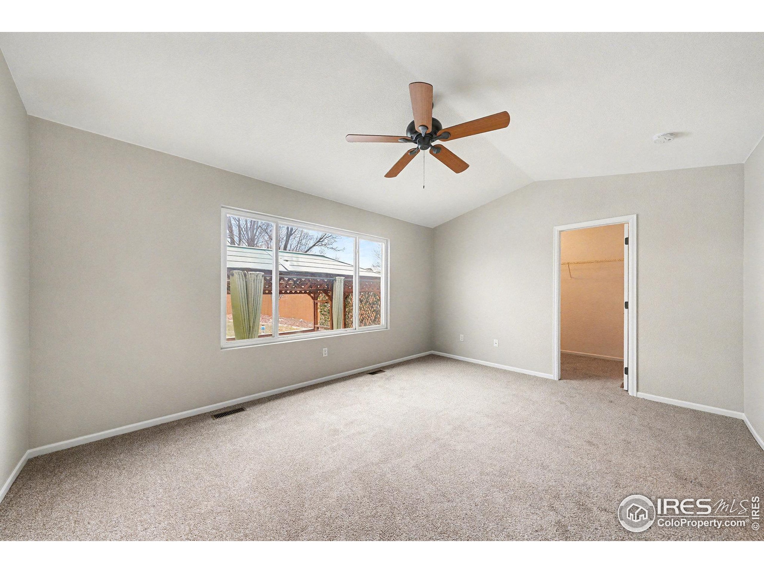 5740 High Street Frederick, CO 80504 - Photo 7 of 34 a view of room with a ceiling fan and window