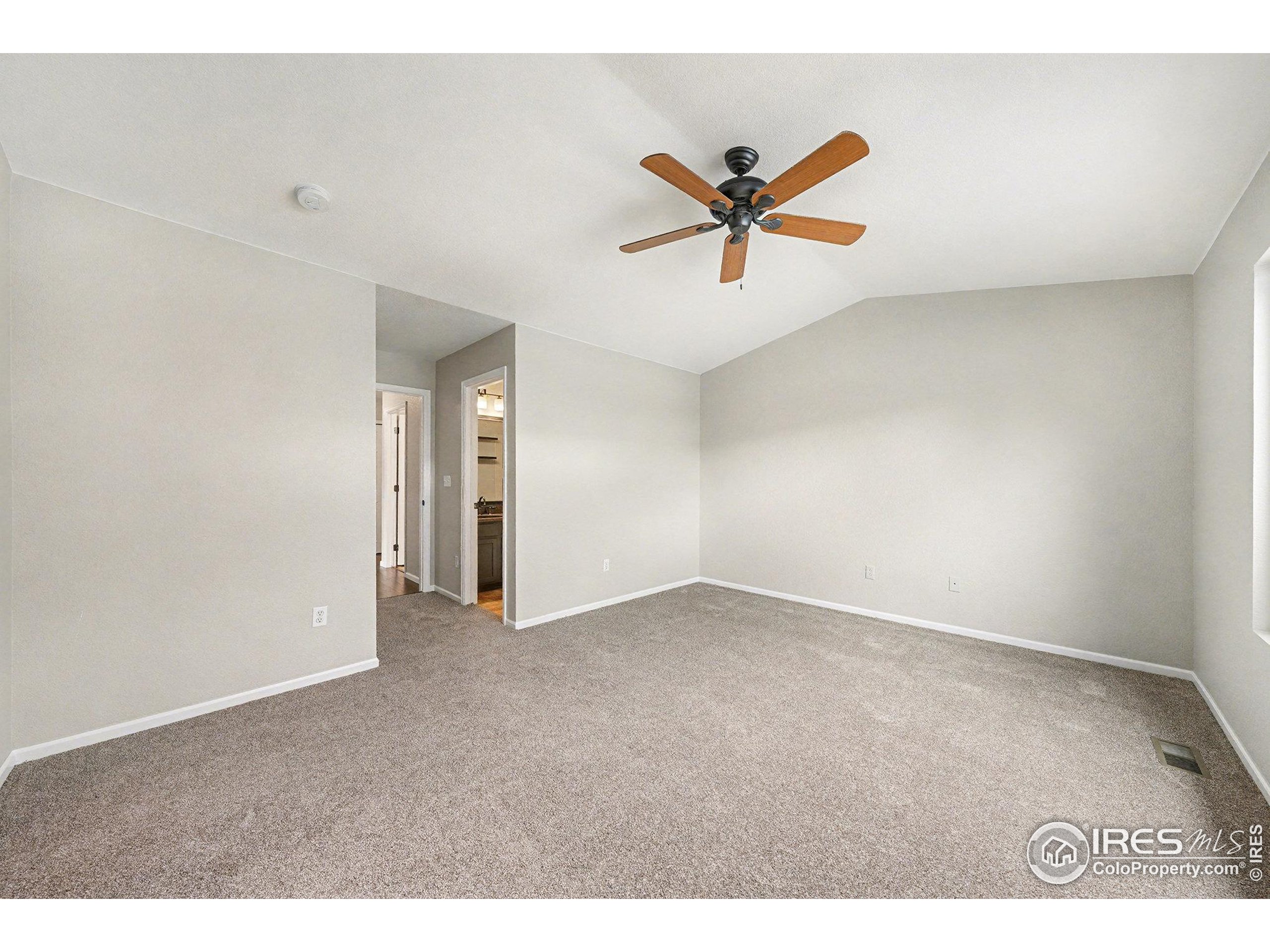 5740 High Street Frederick, CO 80504 - Photo 8 of 34 a view of a big room with wooden floor and windows