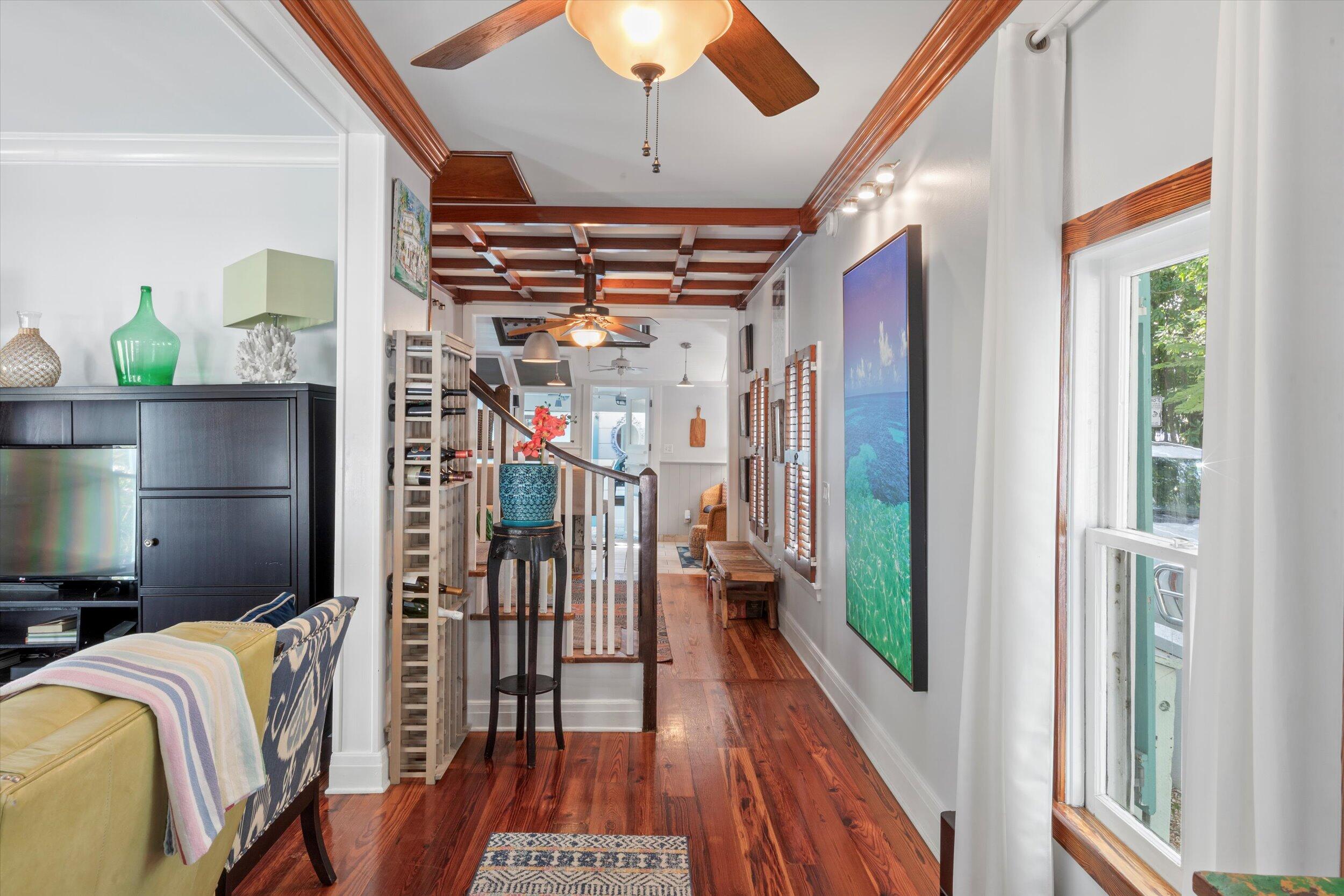 626 Margaret Street Key West, FL 33040 - Photo 11 of 45 a view of a hallway with wooden floor and staircase