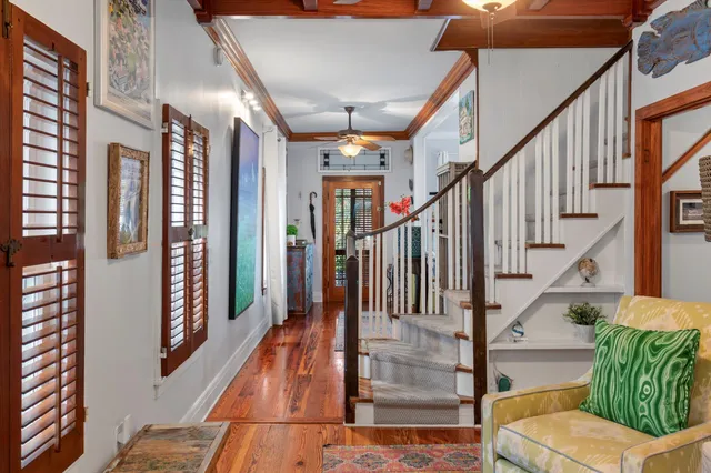 a view of an entryway with wooden floor