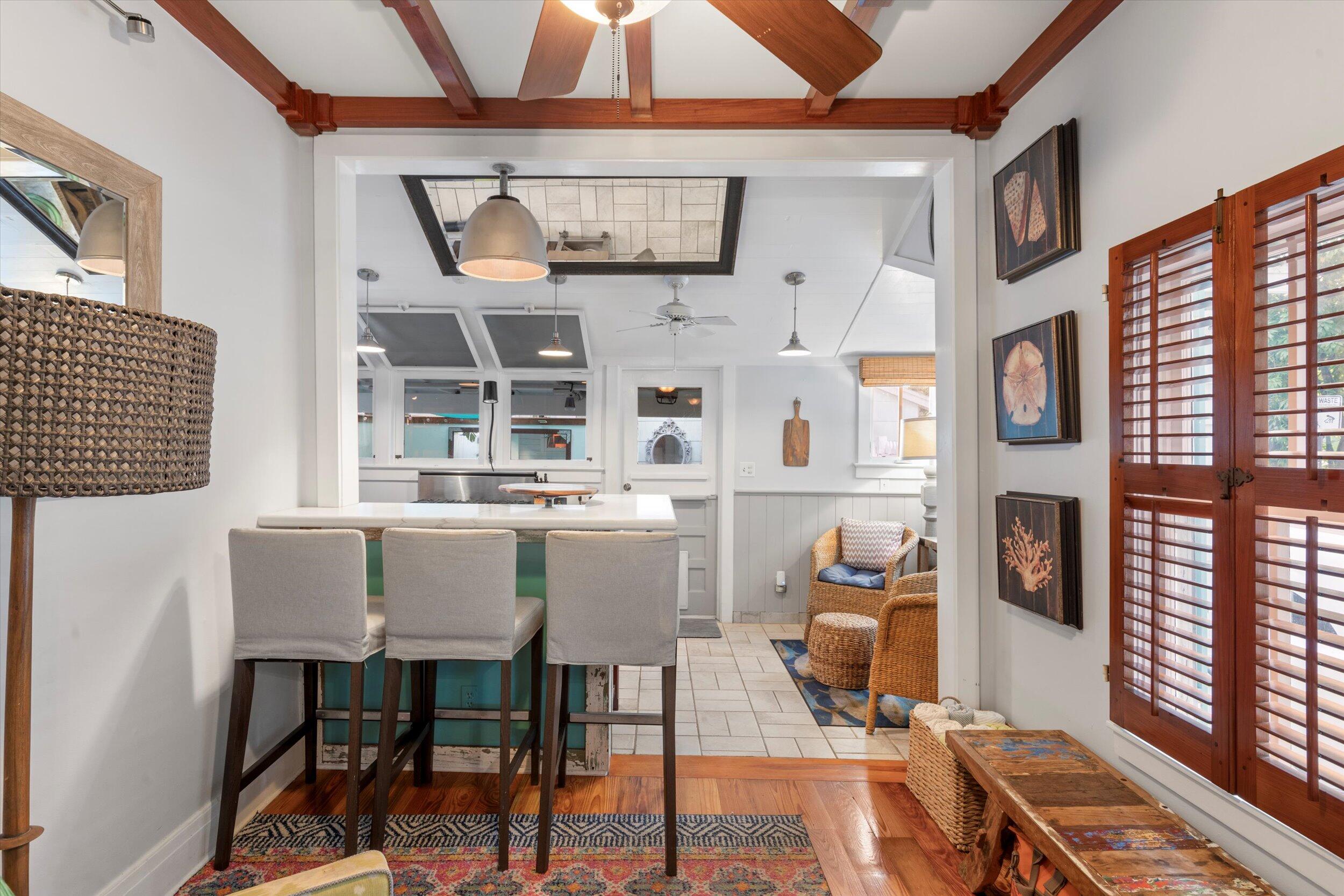 626 Margaret Street Key West, FL 33040 - Photo 17 of 45 a view of a dining room with furniture and chandelier