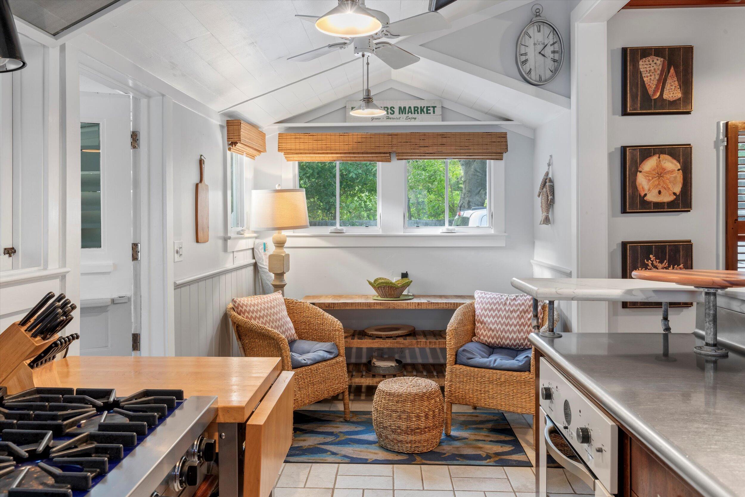 626 Margaret Street Key West, FL 33040 - Photo 20 of 45 a kitchen with a stove a sink and a dining table