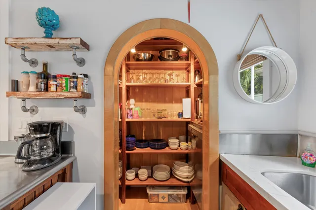 a kitchen with a refrigerator a sink and a window