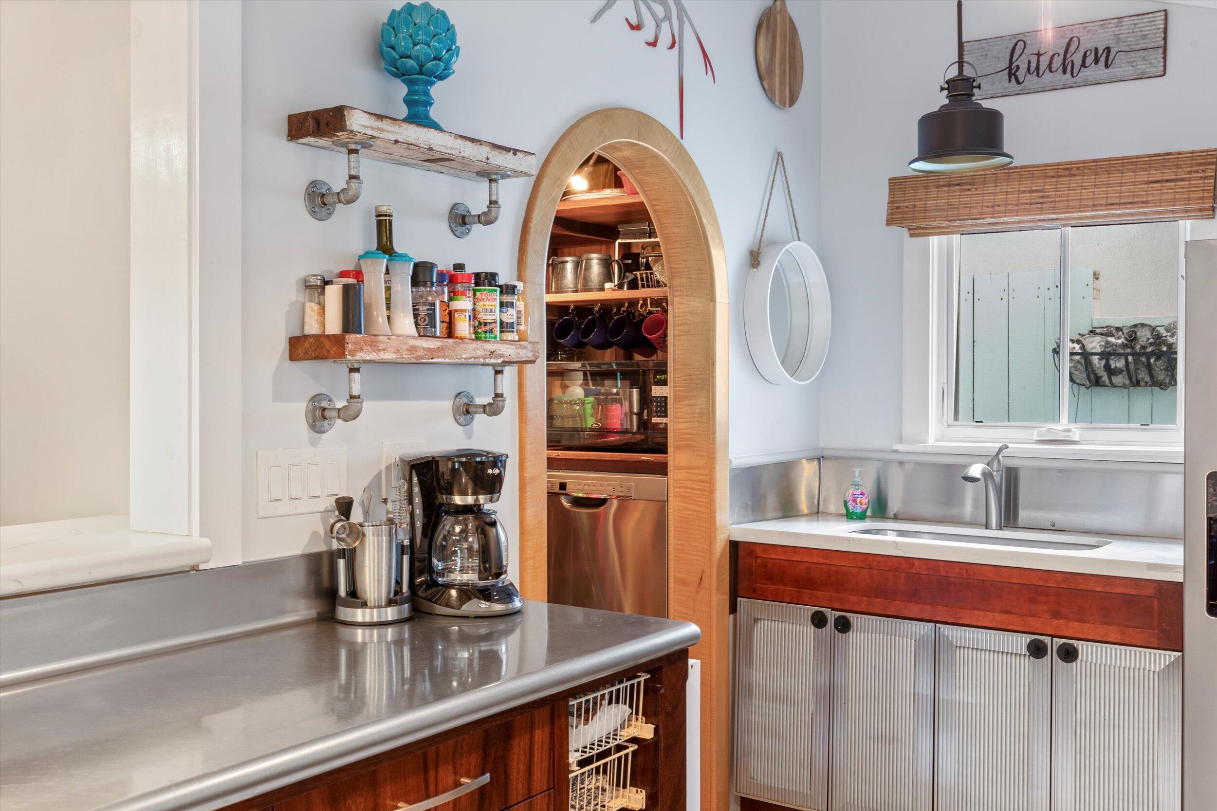 626 Margaret Street Key West, FL 33040 - Photo 23 of 45 a kitchen with a refrigerator a sink and a window