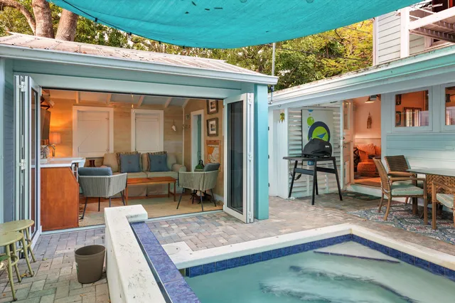 a living room with furniture a rug and a table