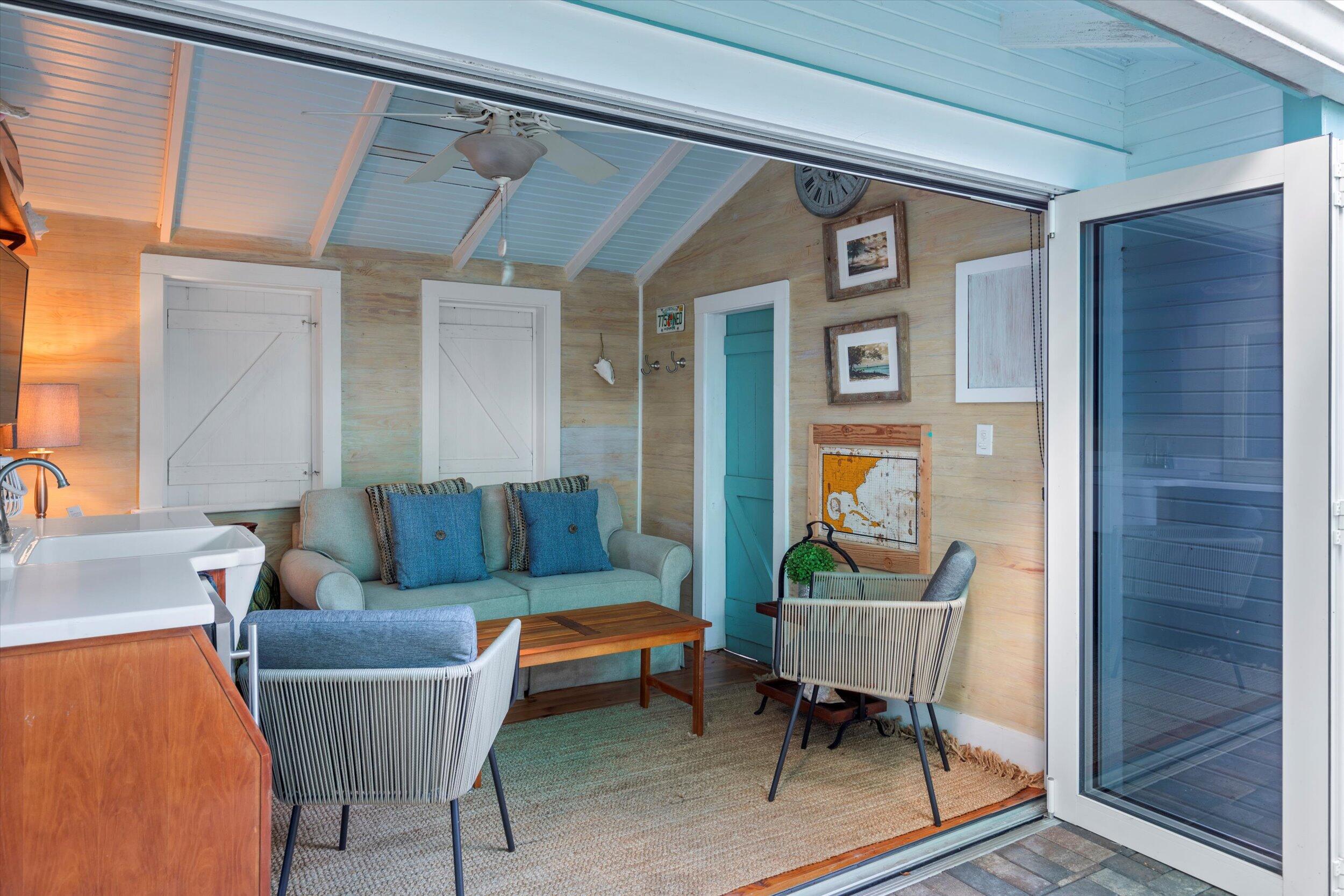 626 Margaret Street Key West, FL 33040 - Photo 27 of 45 a living room with furniture a rug and a table