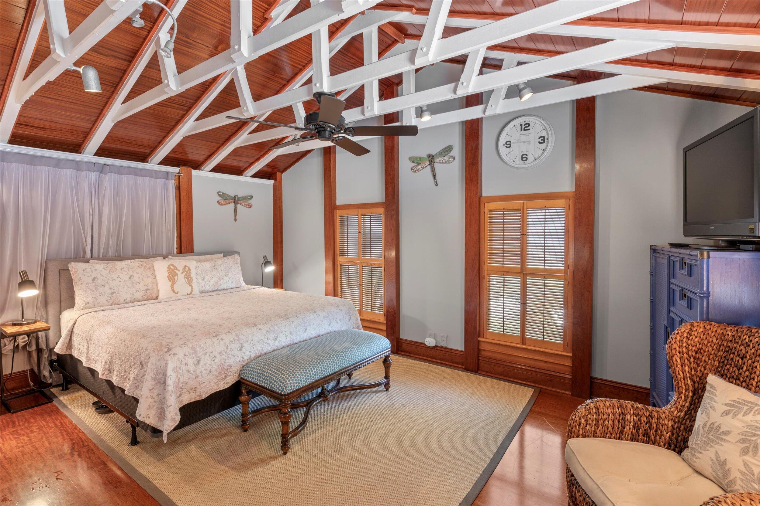 626 Margaret Street Key West, FL 33040 - Photo 32 of 45 a bedroom with a bed and wooden floor