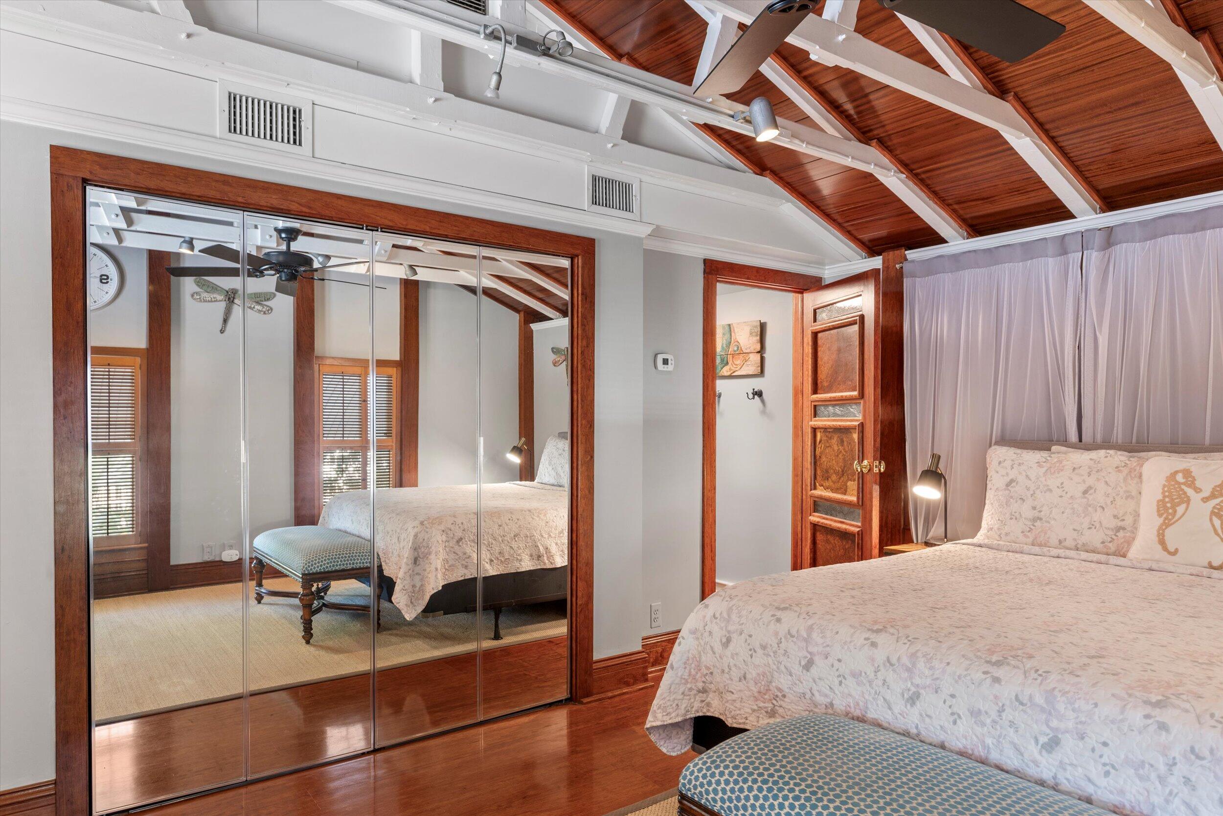 626 Margaret Street Key West, FL 33040 - Photo 34 of 45 a bedroom with a bed and a chandelier