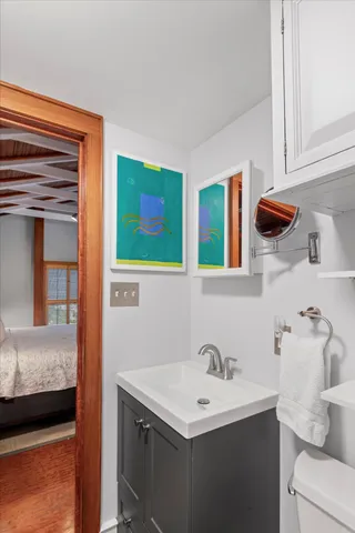 a bathroom with a toilet sink and shower