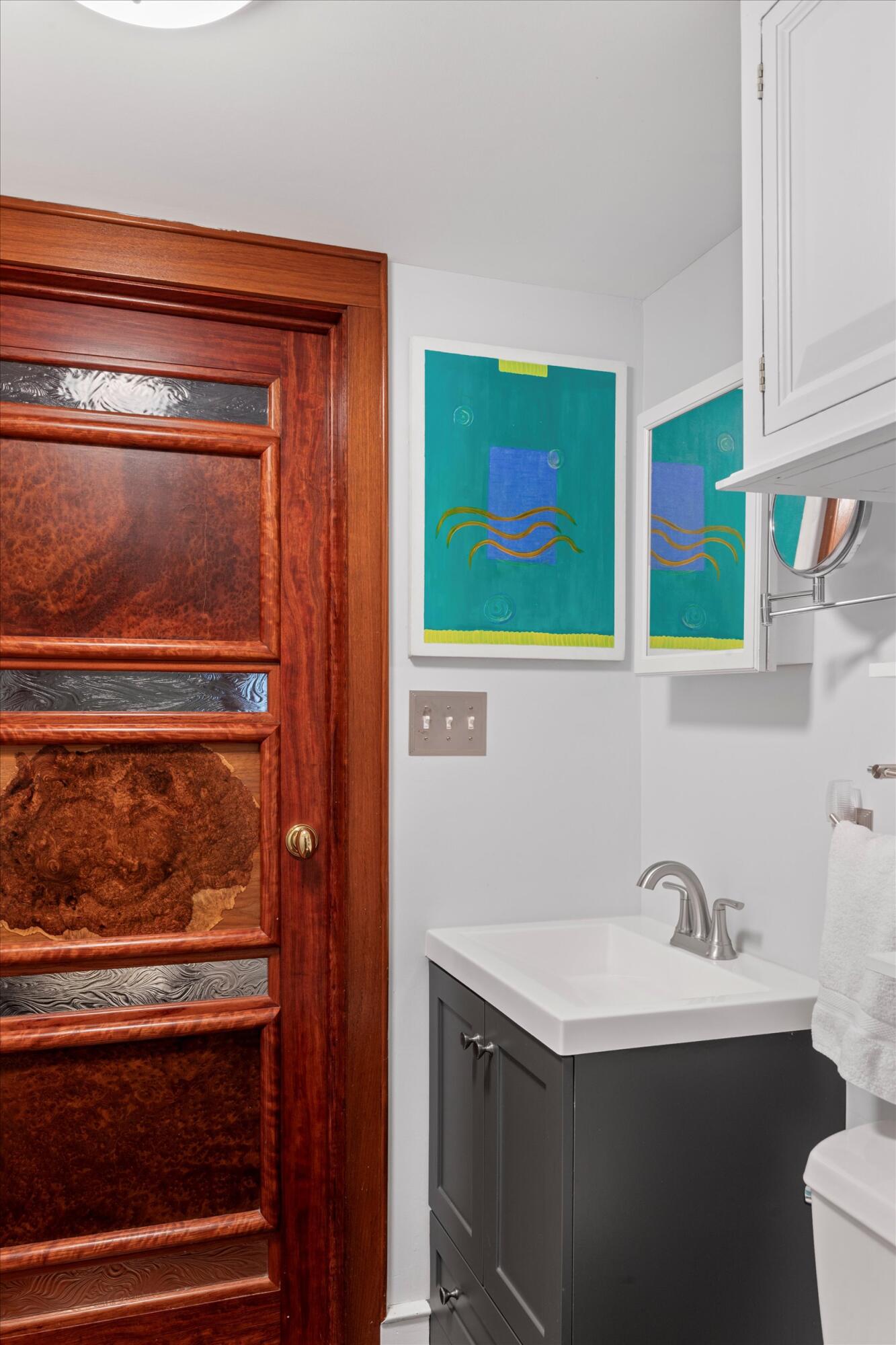 626 Margaret Street Key West, FL 33040 - Photo 38 of 45 a bathroom with a sink and a mirror