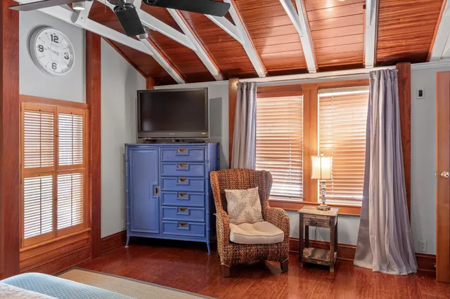 a bedroom with a large bed and a window