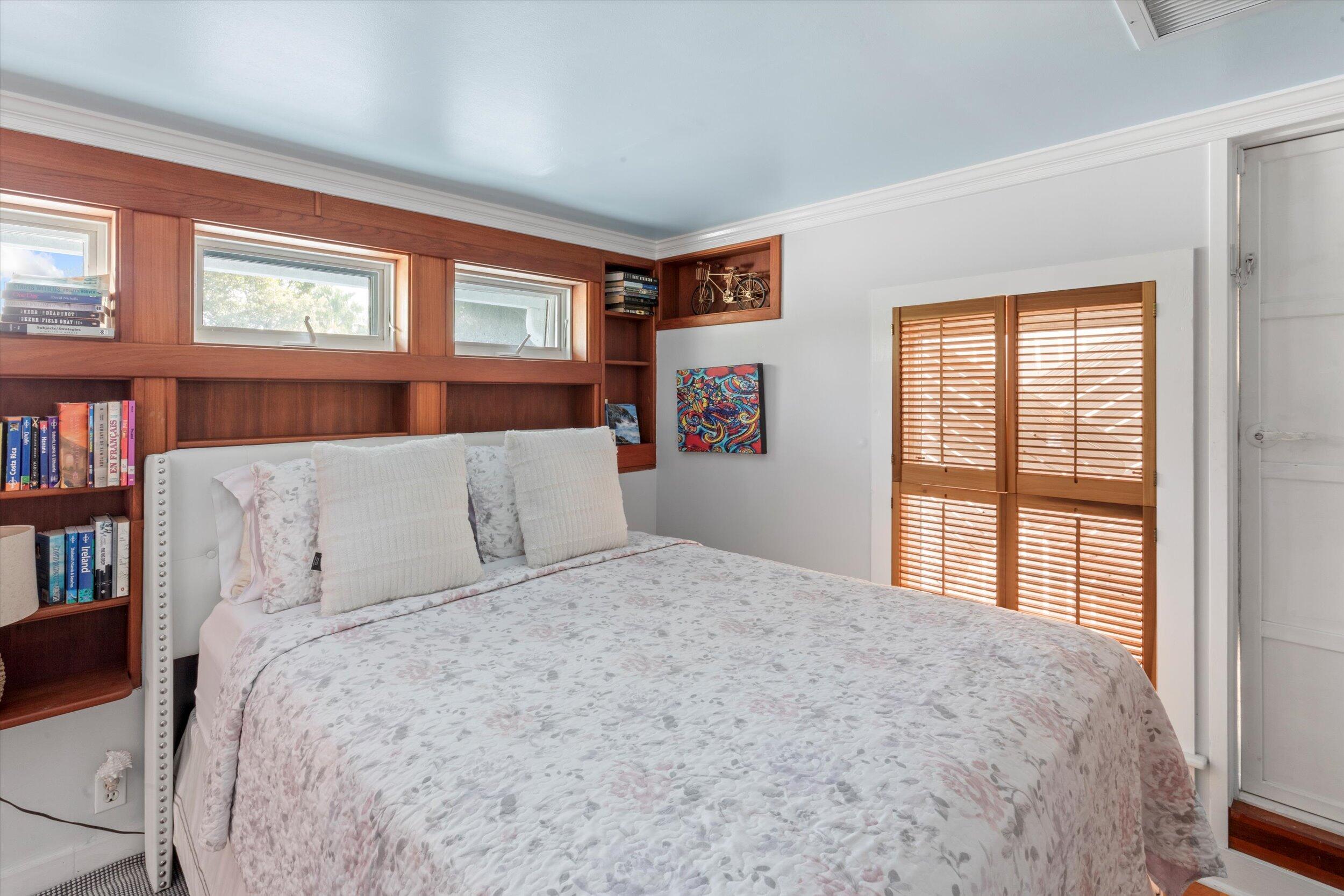 626 Margaret Street Key West, FL 33040 - Photo 42 of 45 a large bed sitting in a bedroom next to a large window