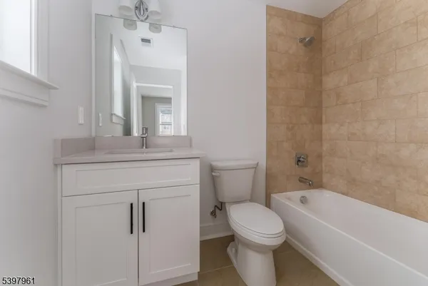 a spacious bathroom with double vanity sink and a mirror